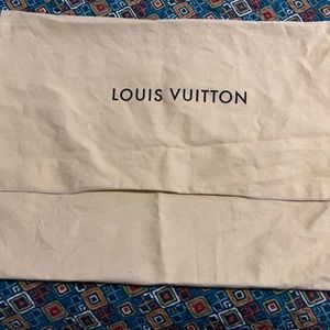LV dust bag for large bag . It has a small spot on back showed pictures stained